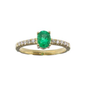 Anillo de oro amarillo 18k con esmeralda ovalada colombiana y diamantes laterales, joyería artesanal